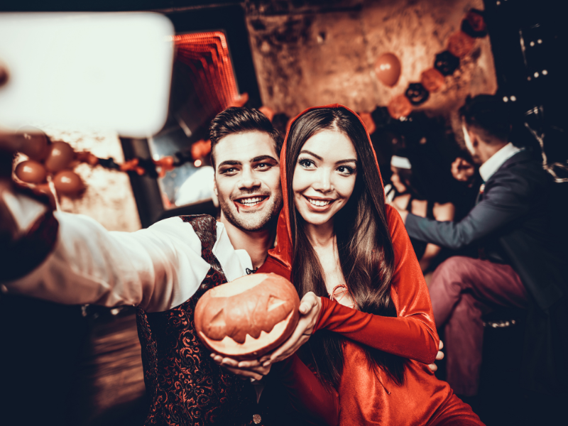 allow employees to dress up for halloween - couple at a halloween party dressed up